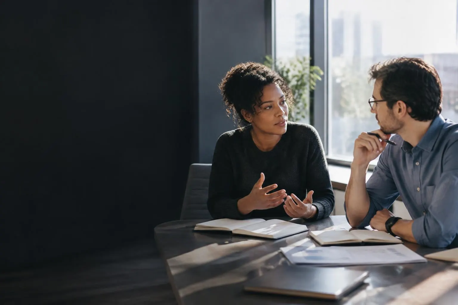 Two healthcare professionals in conversation