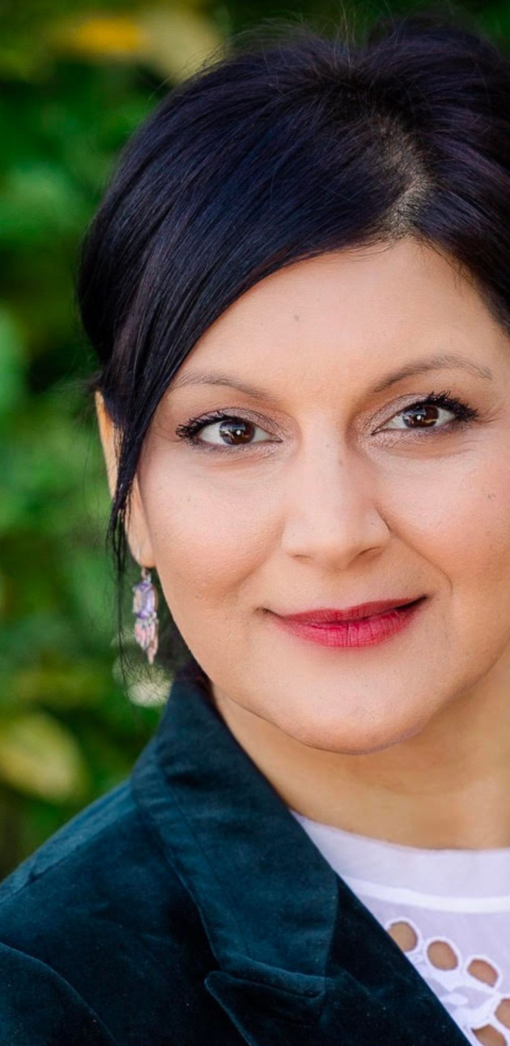 Outdoor portrait of Dr. Nafysa Parpia, ND, naturopathic physician specializing in complex chronic illness